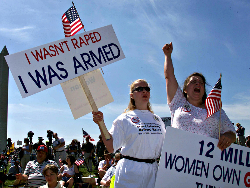 Members of the gun rights group Second Amendment Sisters make themeselevs heard near the Washington Monument on April 14, 2014. (Photo: Chuck Kennedy/KRT/Newscom)